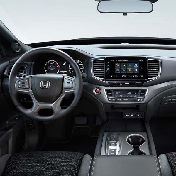 Interior of a 2025 Honda Ridgeline showing steering wheel and dashboard.