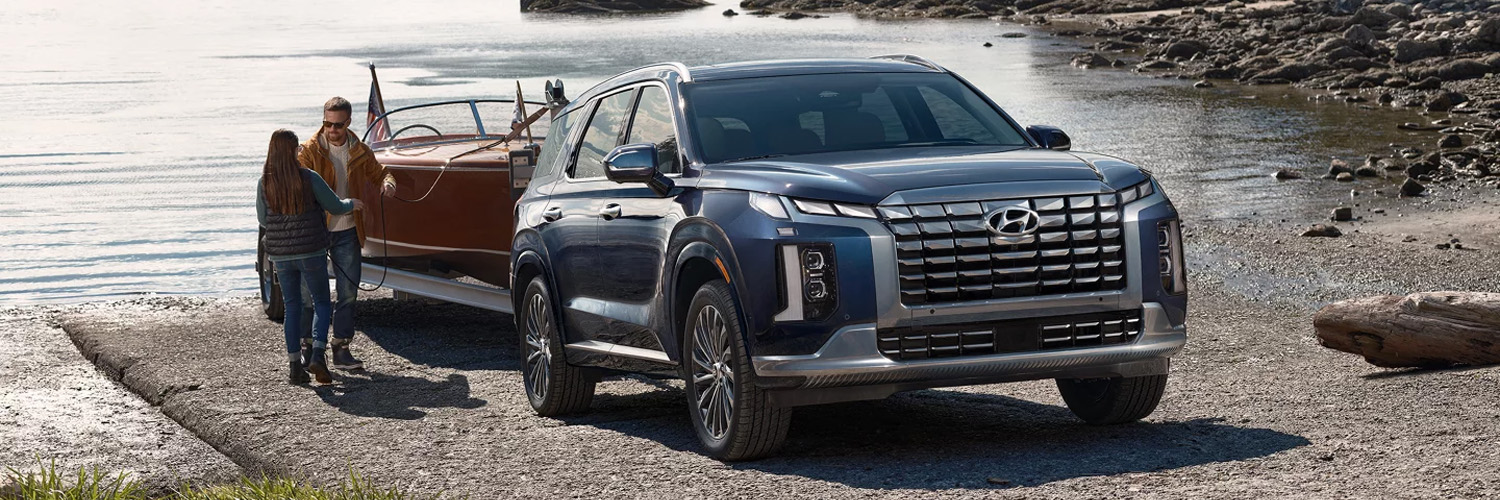 2025 Hyundai Palisade towing a boat on a ramp.