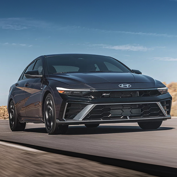 The 2025 Hyundai Elantra driving on a road