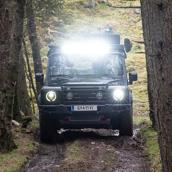 Head on shot of the 2025 INEOS Grenadier in forest.