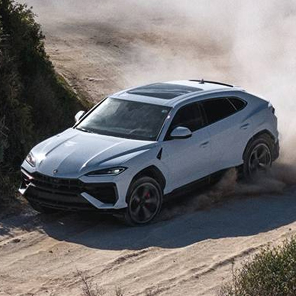 Overhead shot of the Lamborghini Urus drifting on dirt road