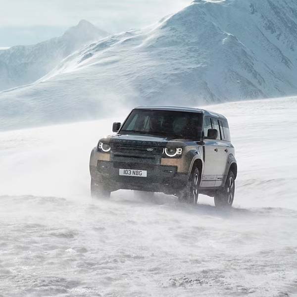 Defender driving on snowy off-road