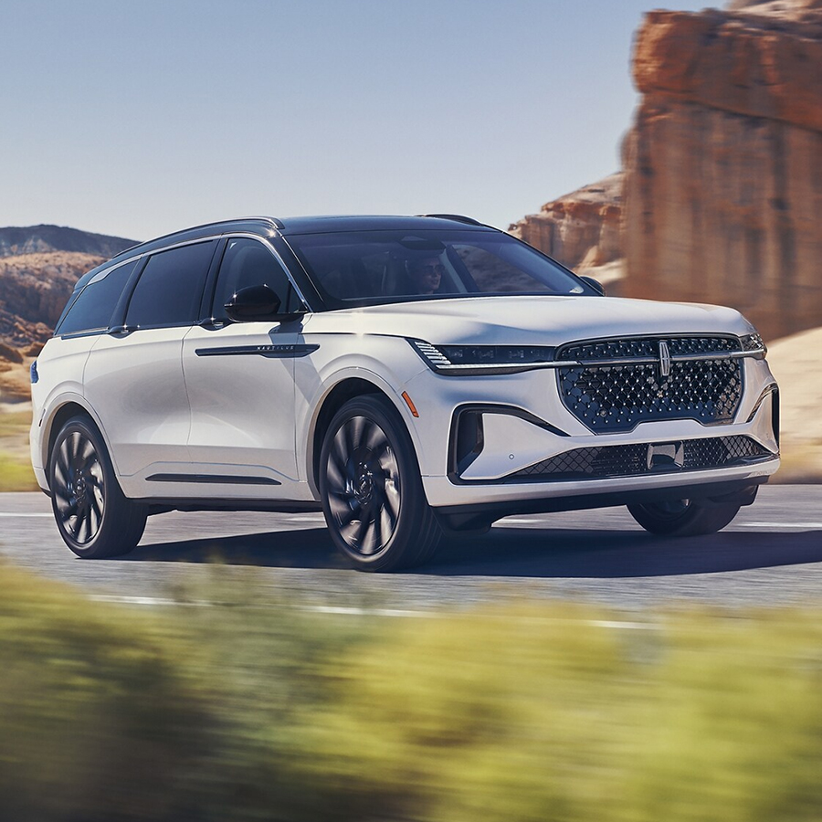 A 2025 Lincoln Black Label Nautilus® SUV is being driven on a desert highway