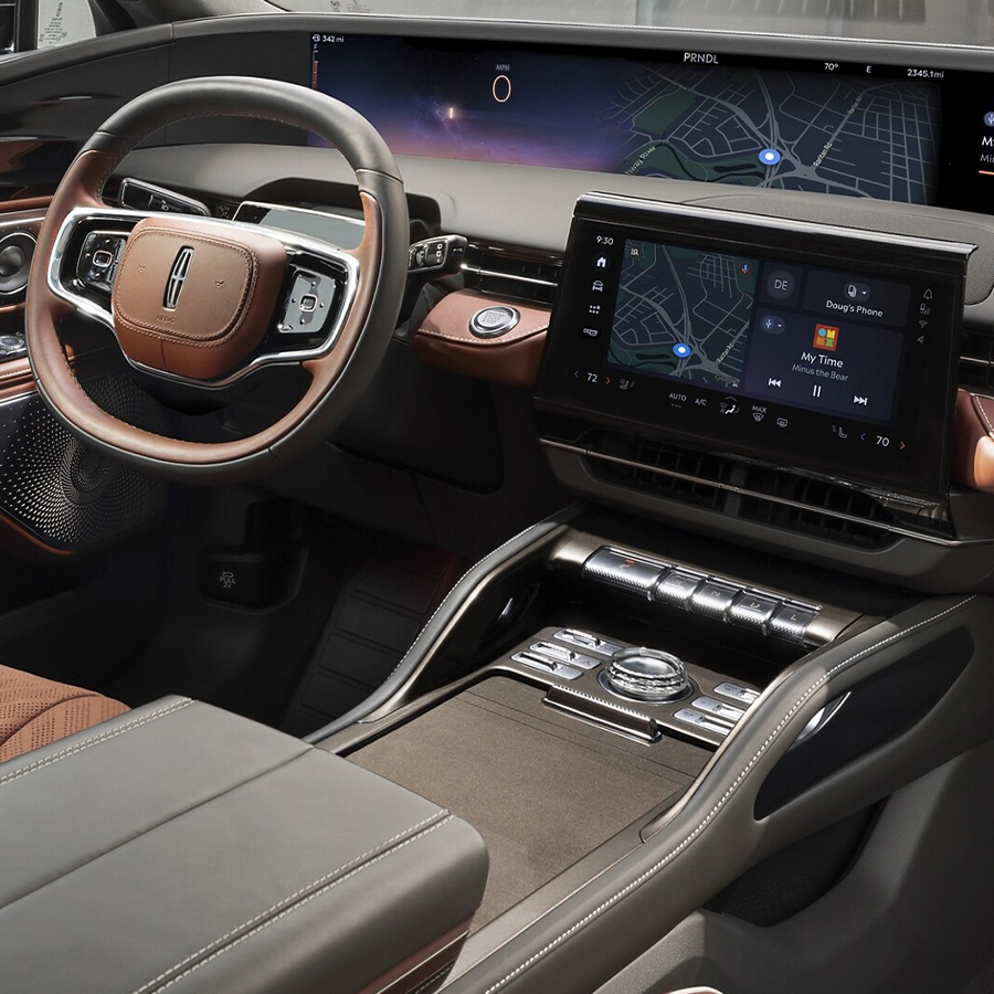 The spacious cabin of a 2025 Lincoln Black Label Nautilus® SUV is shown in the Redwood theme