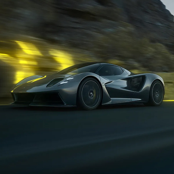 exotic car driving down road
