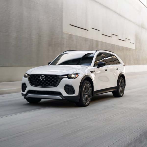 new mazda driving towards camera