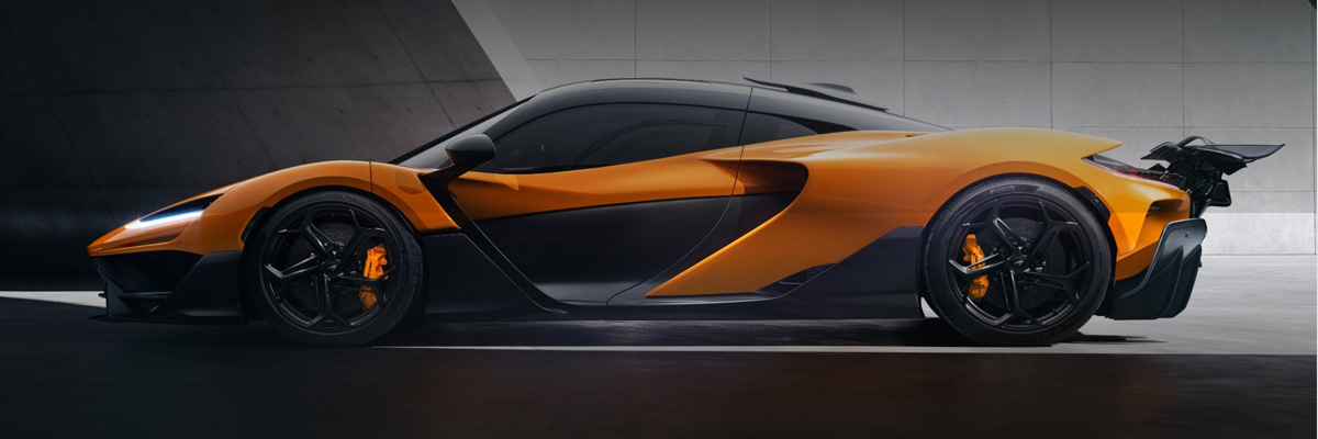 Profile view of orange 2025 McLaren W1.