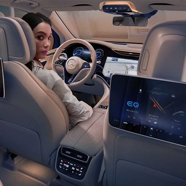 Stylish woman sitting in the 2025 Mercedes-Benz EQS SUV