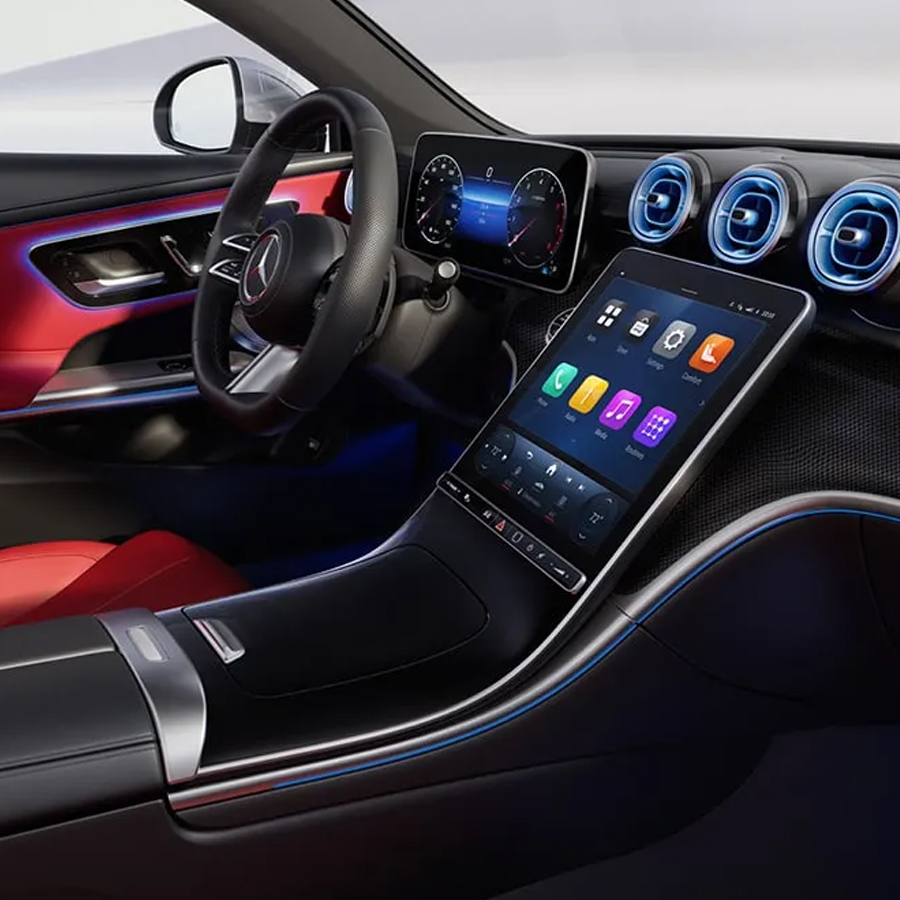 CLE 300 4MATIC in Power Red/Black leather with AMG Line and Metal Weave trim. The 11.9-inch portrait-style center touchscreen is gently canted toward the driver.