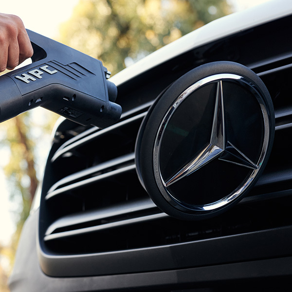 Up close shot of the 2025 Mercedes-Bezn eSprinter Van being plugged into charger