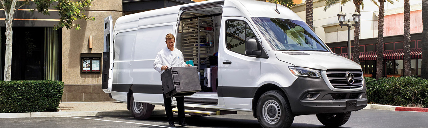 Man unloading side of Sprinter van