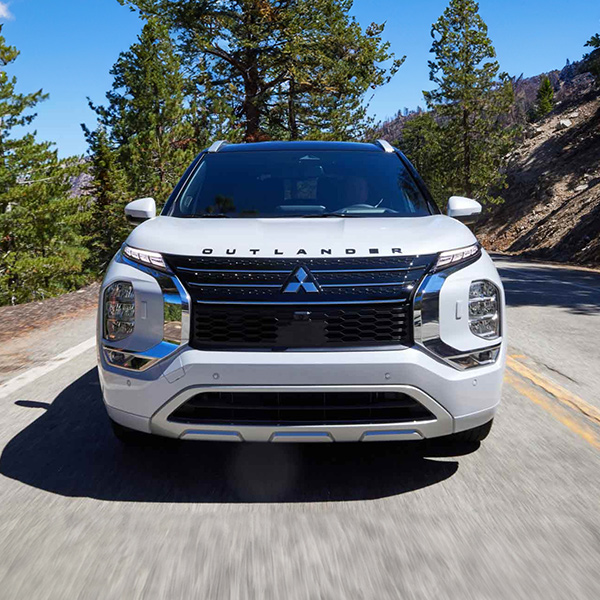 Front view of a white 2025 Mitsubishi Outlander PHEV SUV