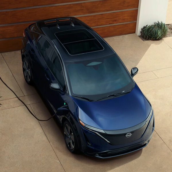 The 2025 Nissan ARIYA parked and charging