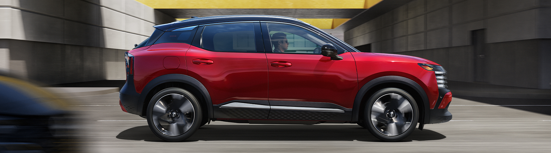 2025 Nissan Kicks SR AWD Premium Package, Two-tone Scarlet Ember Tintcoat/Super Black, exterior, profile, driving
