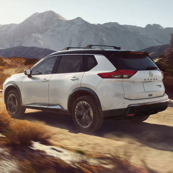 2025 Nissan Rogue driving on a dirt road