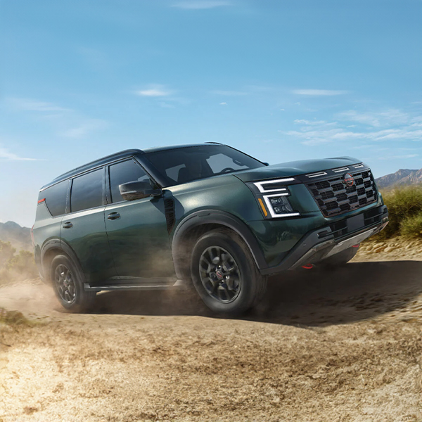 2025 Nissan Armada driving on a dirt path