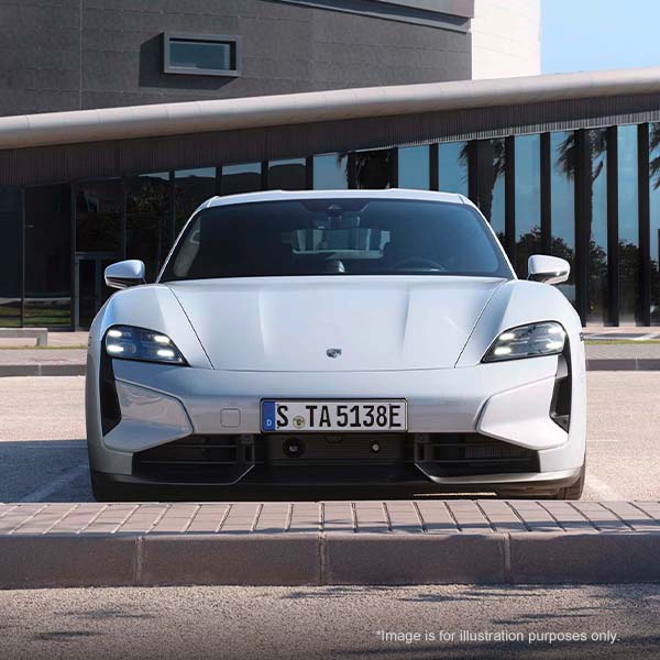 Porsche Taycan parked in a parking space.