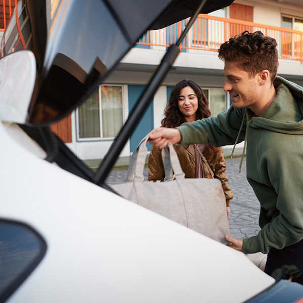 People unloading the trunk of the 2025 Subaru Impreza