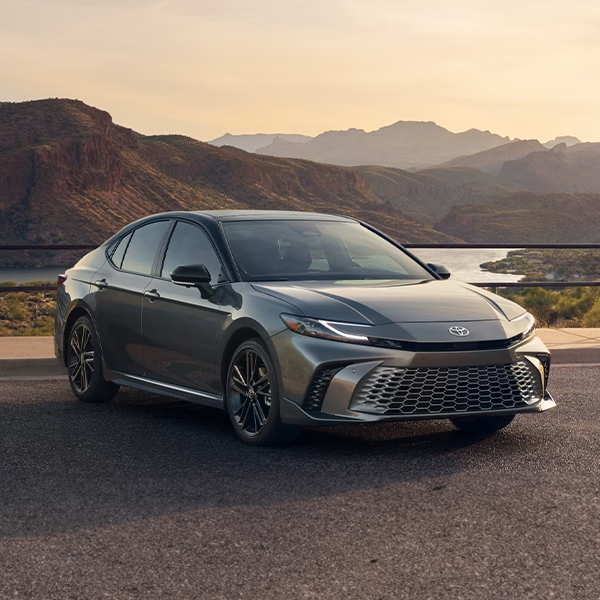 The 2025 Toyota Camry parked in front of mountains