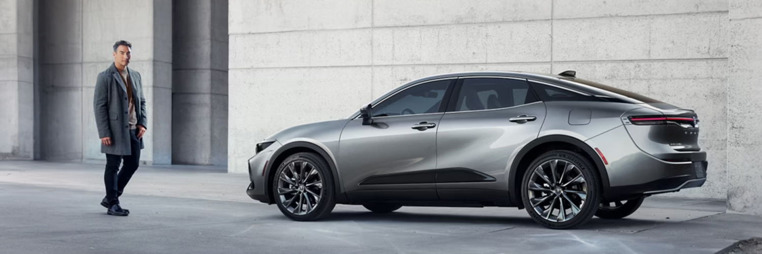 Stylish man walking beside a Toyota Hybrid vehicle
