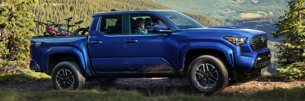Toyota Tacoma driving along a rurual road