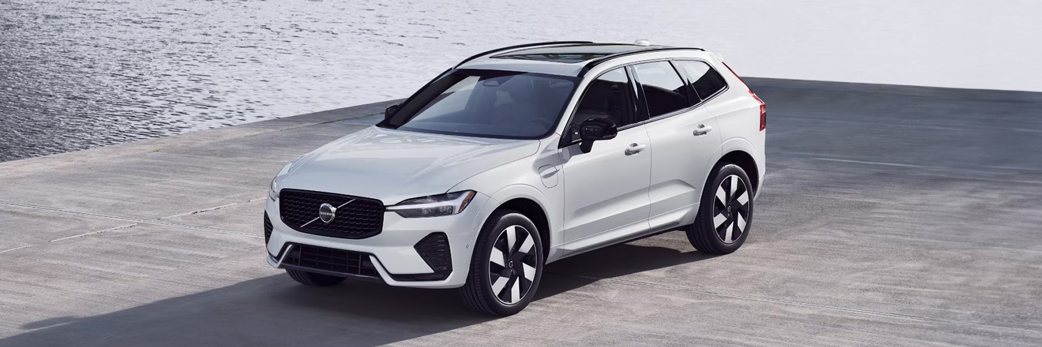Overhead 3/4 shot of the 2025 Volvo XC60 Recharge parked near water