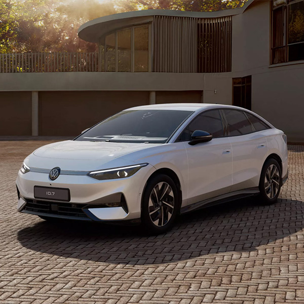 A ID.7 Pro Match parked in front of a modern house