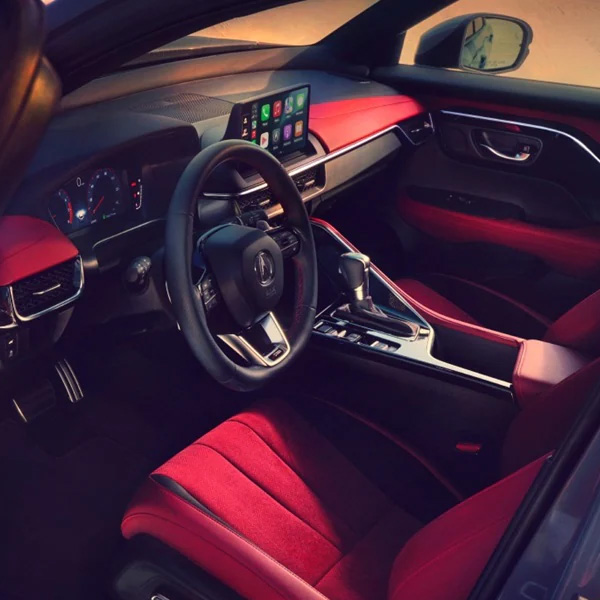 Front row of 2026 Acura ADX with red interior