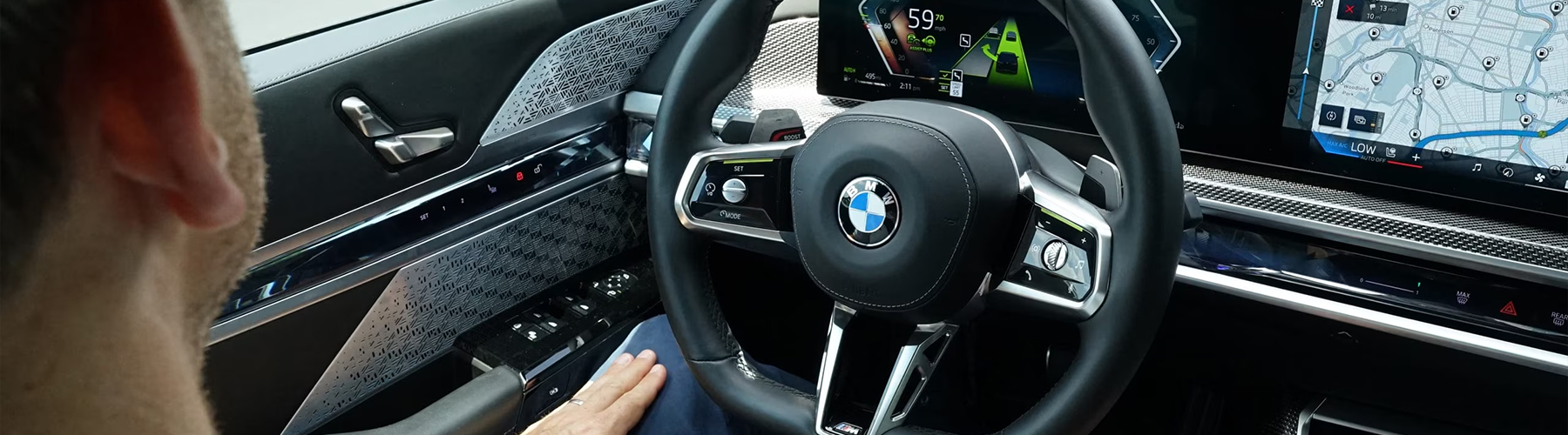 Detail of driver sitting behind the wheel