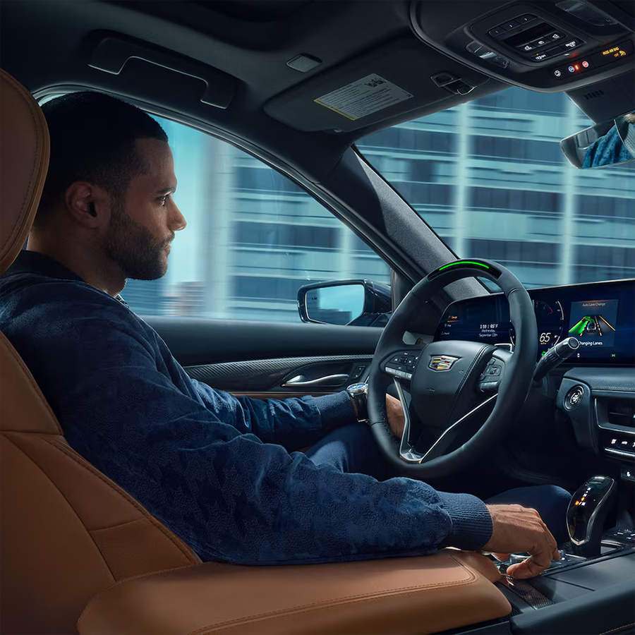 A Man Driving a 2026 Cadillac CT5 Utilizing the Super Cruise Feature