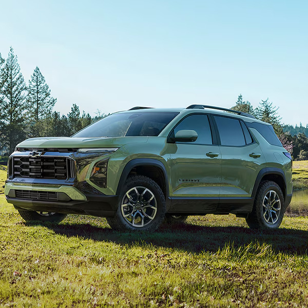 2026 Chevy Equinox parked in grass field.
