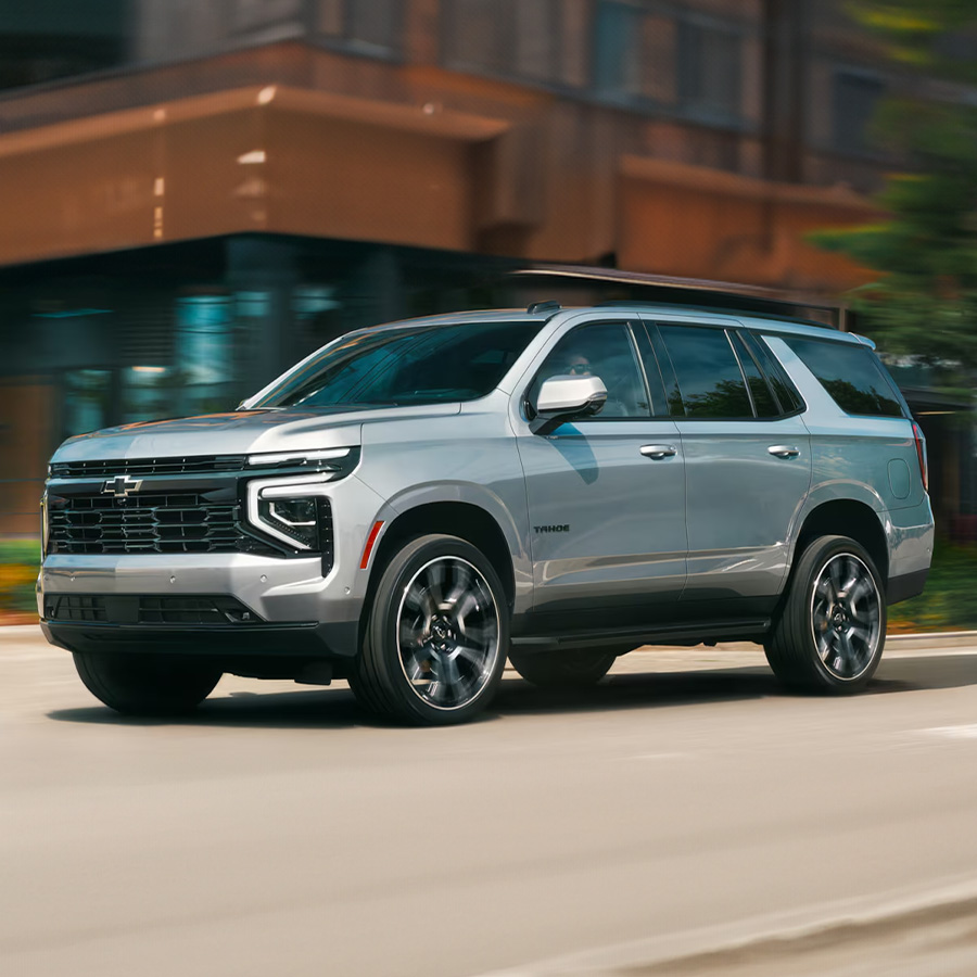 2026 Chevy Tahoe in motion driving through the city