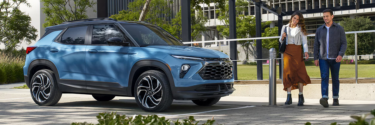 A Couple Walking Up to Their Parked 2026 Chevy Trailblazer.