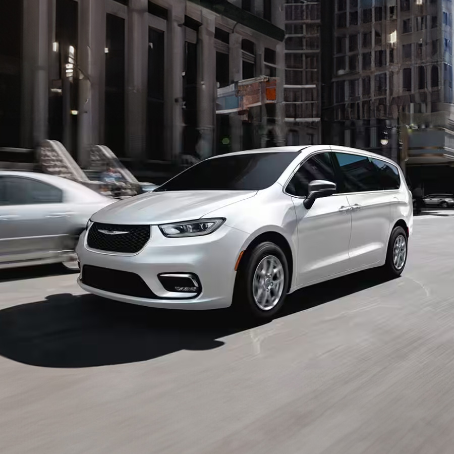 The 2026 Chrysler Pacifica in motion driving through the city