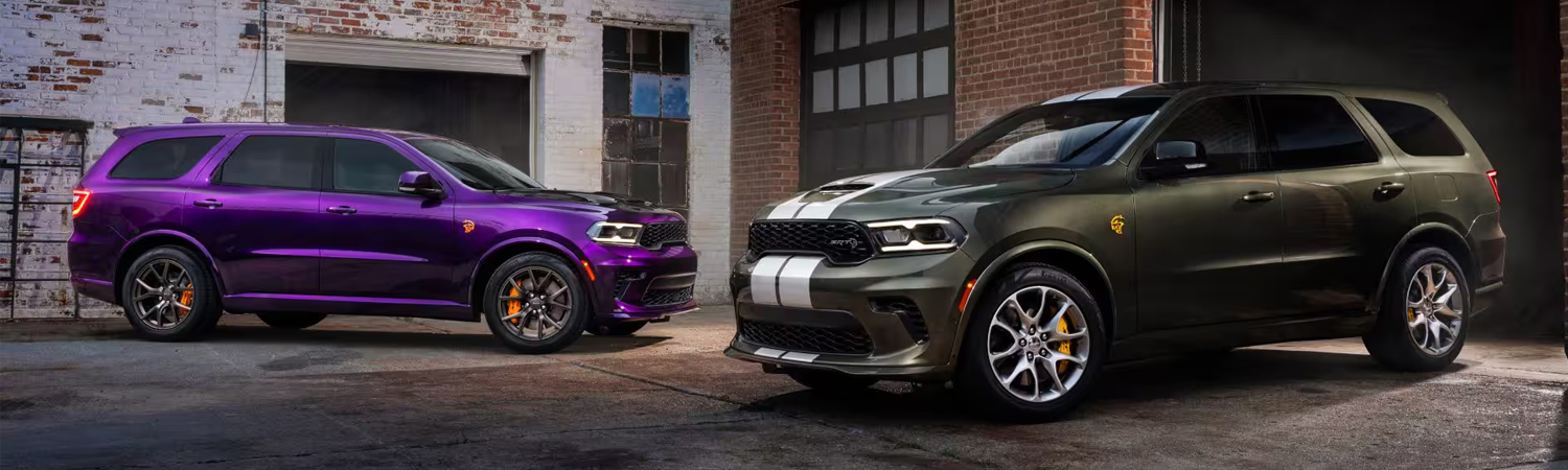 two 2026 Dodge Durangos parked outside a brick building
