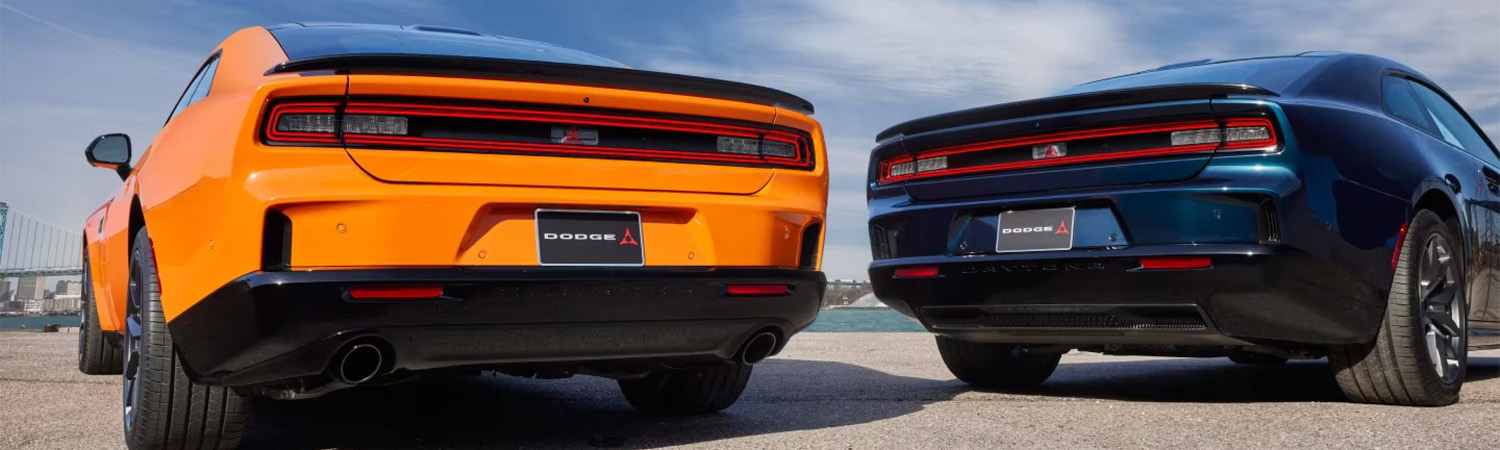 Rear view of two 2026 Dodge Chargers parked in a lot