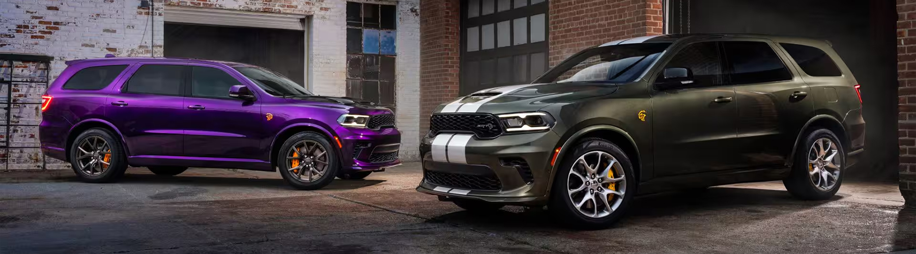 Right: 2026 Dodge Durango in dark green with white racing stripes, shown parked beside a brick building; Left: 2026 Dodge Durango in metallic purple parked in an industrial setting with performance wheels.