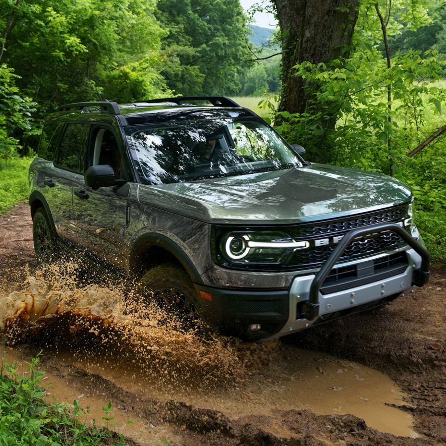 2026 Ford Bronco Sport® being driven on a dirt trail in the woods