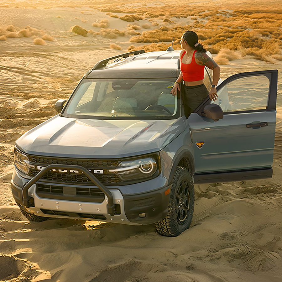 A 2026 Ford Bronco Sport® parked in the desert with a person standing outside the vehicle