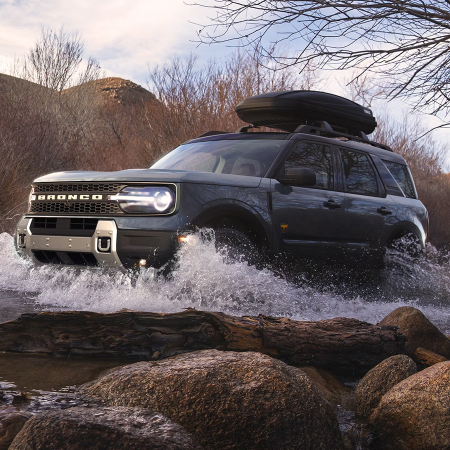 A 2026 Ford Bronco Sport® being driven through a small river