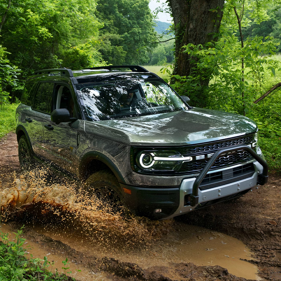 2026 Ford Bronco Sport® being driven on a dirt trail in the woods