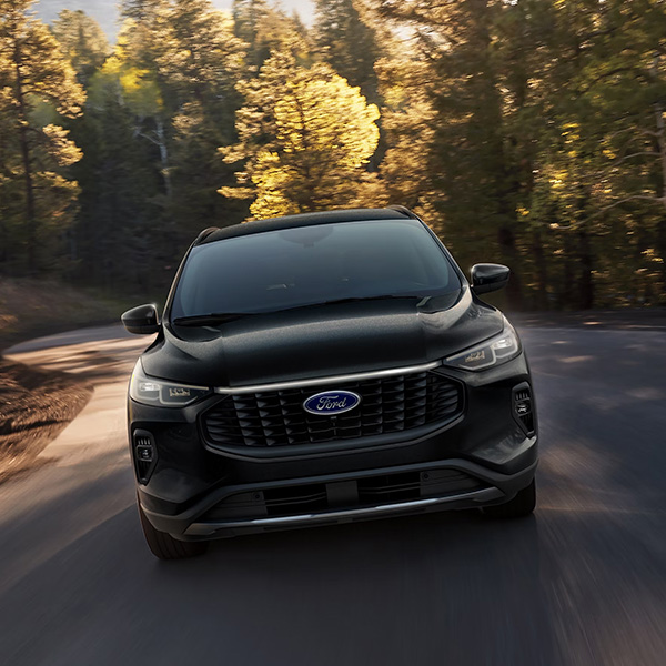 2026 Ford Escape® SUV being driven on a city street