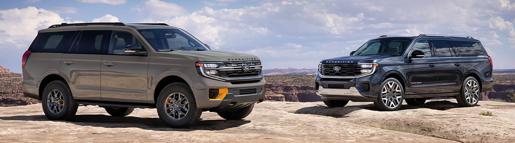 A 2026 Ford Expedition® Tremor® and another Expedition model parked on a rocky outcrop