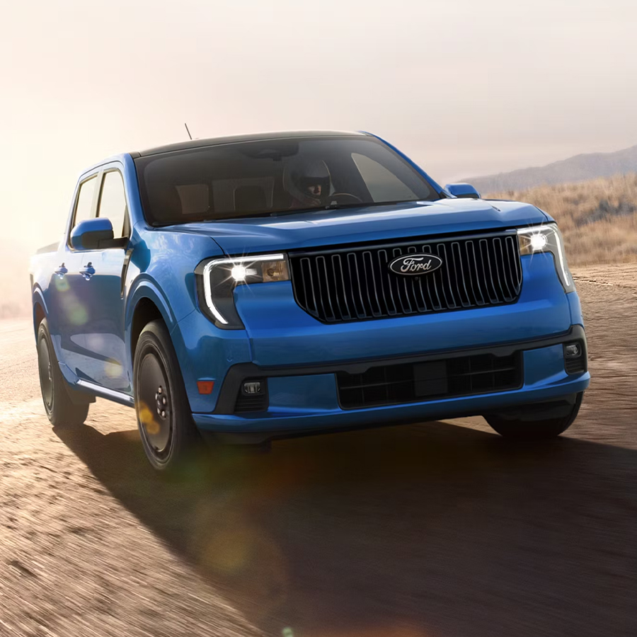 2026 Ford Maverick Lobo® model being driven on a closed course at dusk