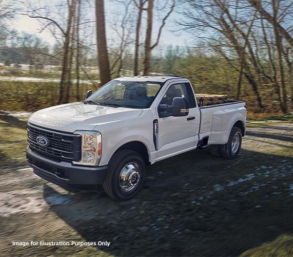 White 2026 Ford Super Duty racing down a rural road