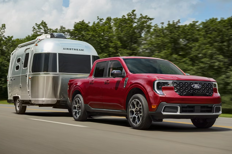 2026 Ford Maverick® pickup towing an Airstream camper trailer