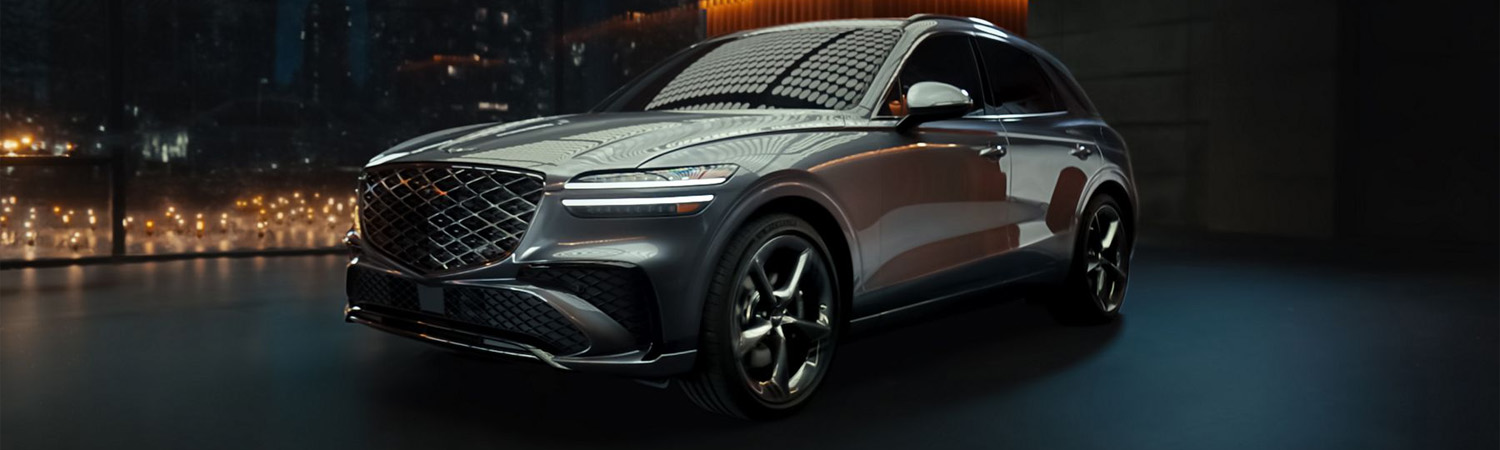 Front driver side view of Genesis GV70 surrounded by robotic light bulbs