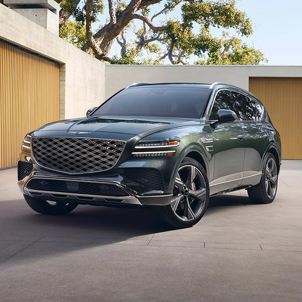 Front 3/4 shot of the 2026 Genesis GV80 parked in a driveway