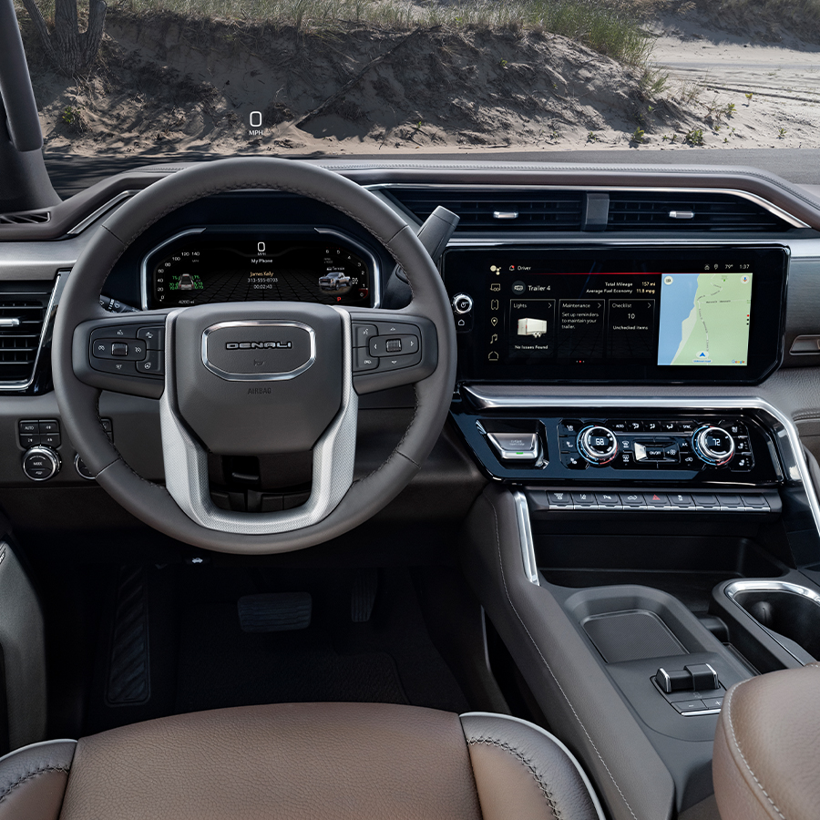 2026 GMC Sierra Denali 3500HD DRW Cockpit with Atmosphere/Brownstone Interior Seating; View from rear seats