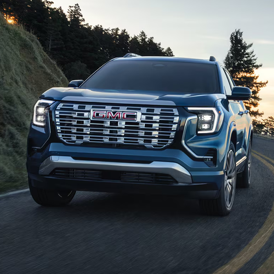 The GMC Terrain Small SUV Driving Down a Winding Road Along the Coast Line